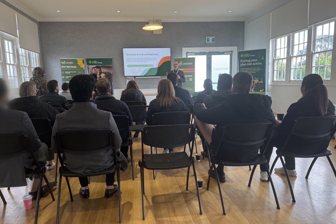 Attendees seated at the information session, Careable and nib Thrive banners at the front